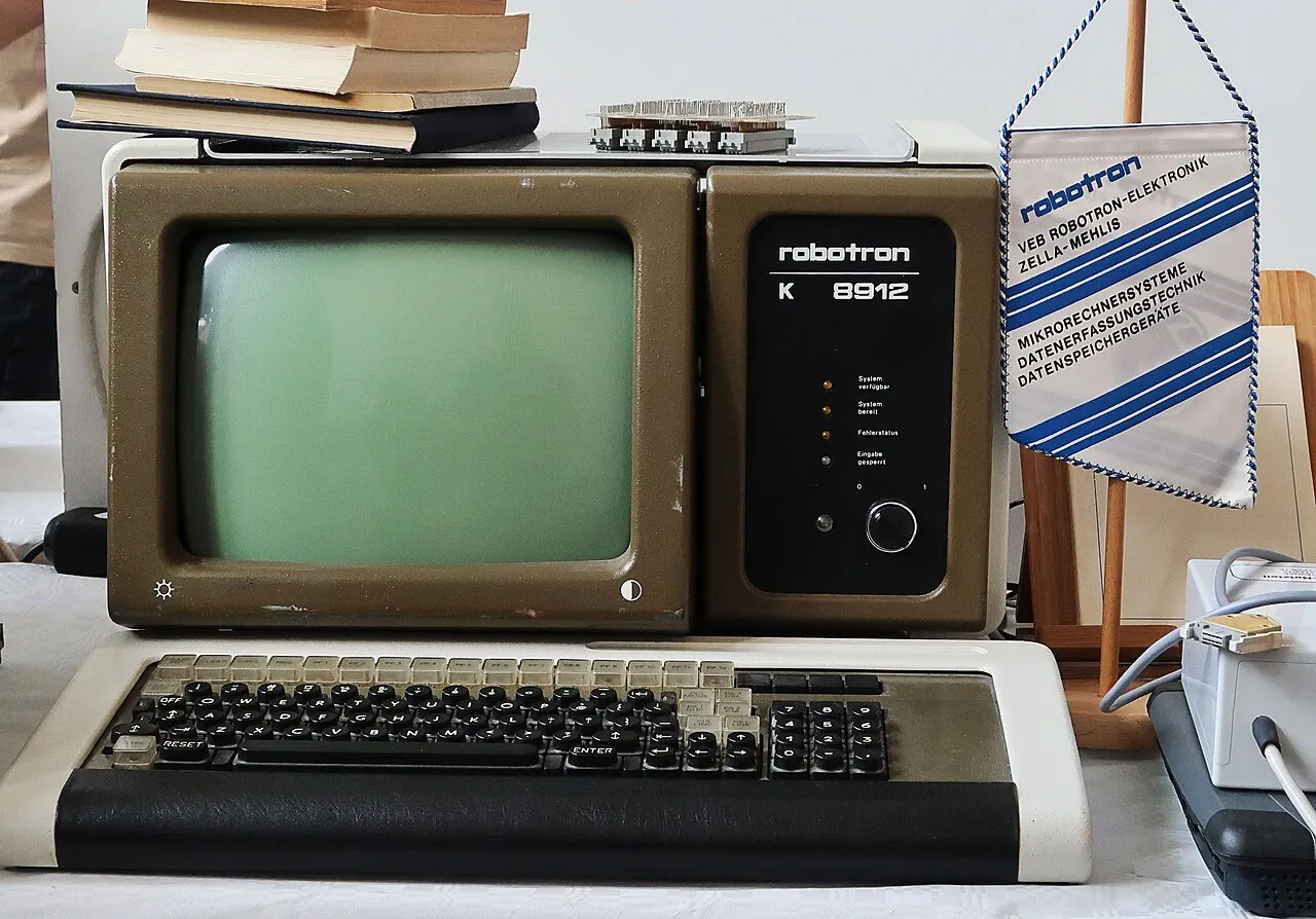 A Robotron K 8912 computer terminal from the early 1980s, its screen dark above a keyboard